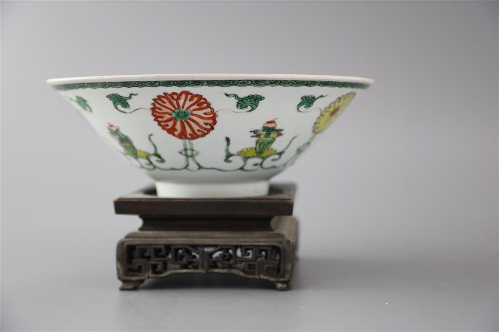 A Chinese famille verte conical shaped bowl, Kangxi period, 20.5cm diameter, ebonised wood stand